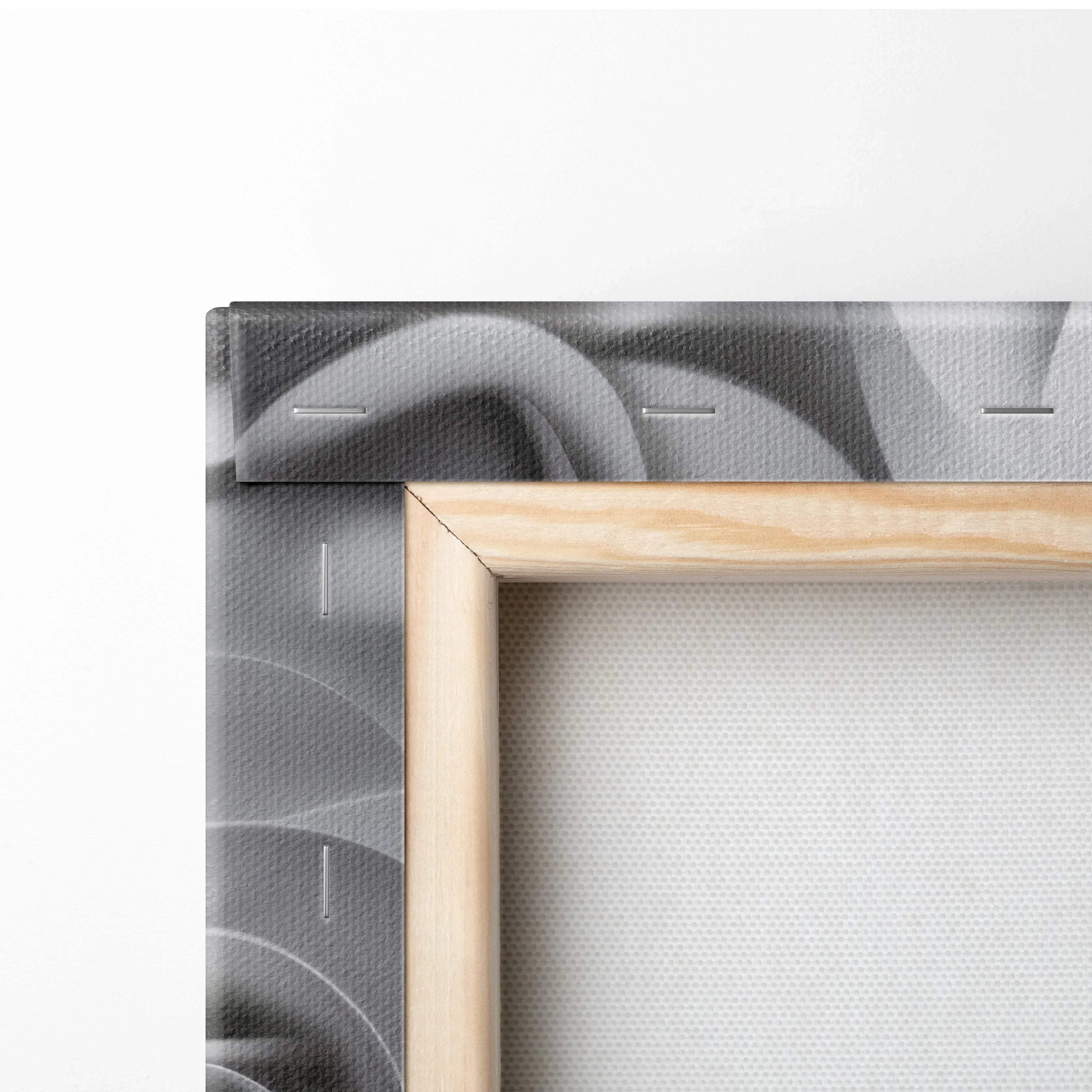 Close-up of wooden-framed canvas wall art featuring grey rose floral design with stitched edges.