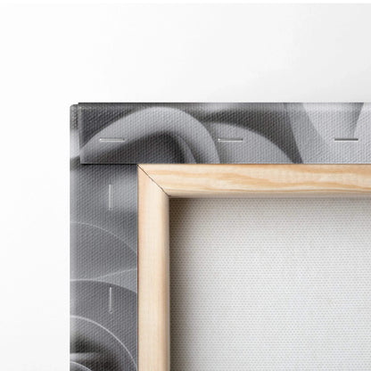 Close-up of wooden-framed canvas wall art featuring grey rose floral design with stitched edges.