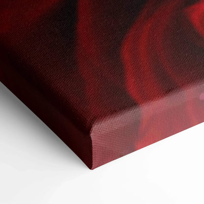 Close-up of textured canvas wall art featuring deep red wet roses with rich color and glossy detail.