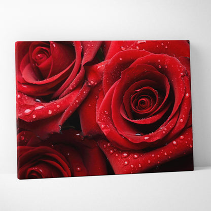 High-resolution canvas wall art featuring wet red roses with water droplets, vibrant floral decor.