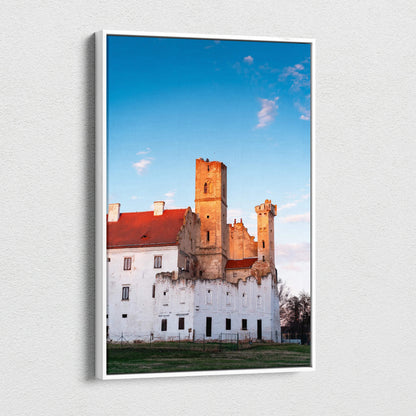Vertical canvas wall art featuring a historic castle with warm sunset lighting against a clear blue sky.