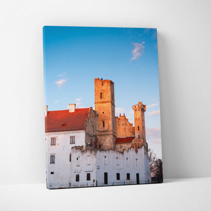 Canvas wall art featuring a castle building under a clear blue sky with soft clouds.