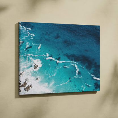 Aerial turquoise ocean canvas wall art print with vibrant crashing waves and rocky outcrops for coastal decor