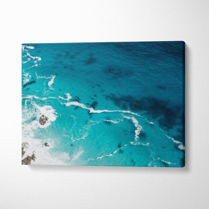 Aerial turquoise ocean canvas wall art print with vibrant crashing waves and rocky outcrops for coastal decor