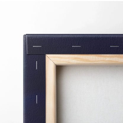 Corner detail of stretched canvas wall art with wooden frame and stapled fabric backing.