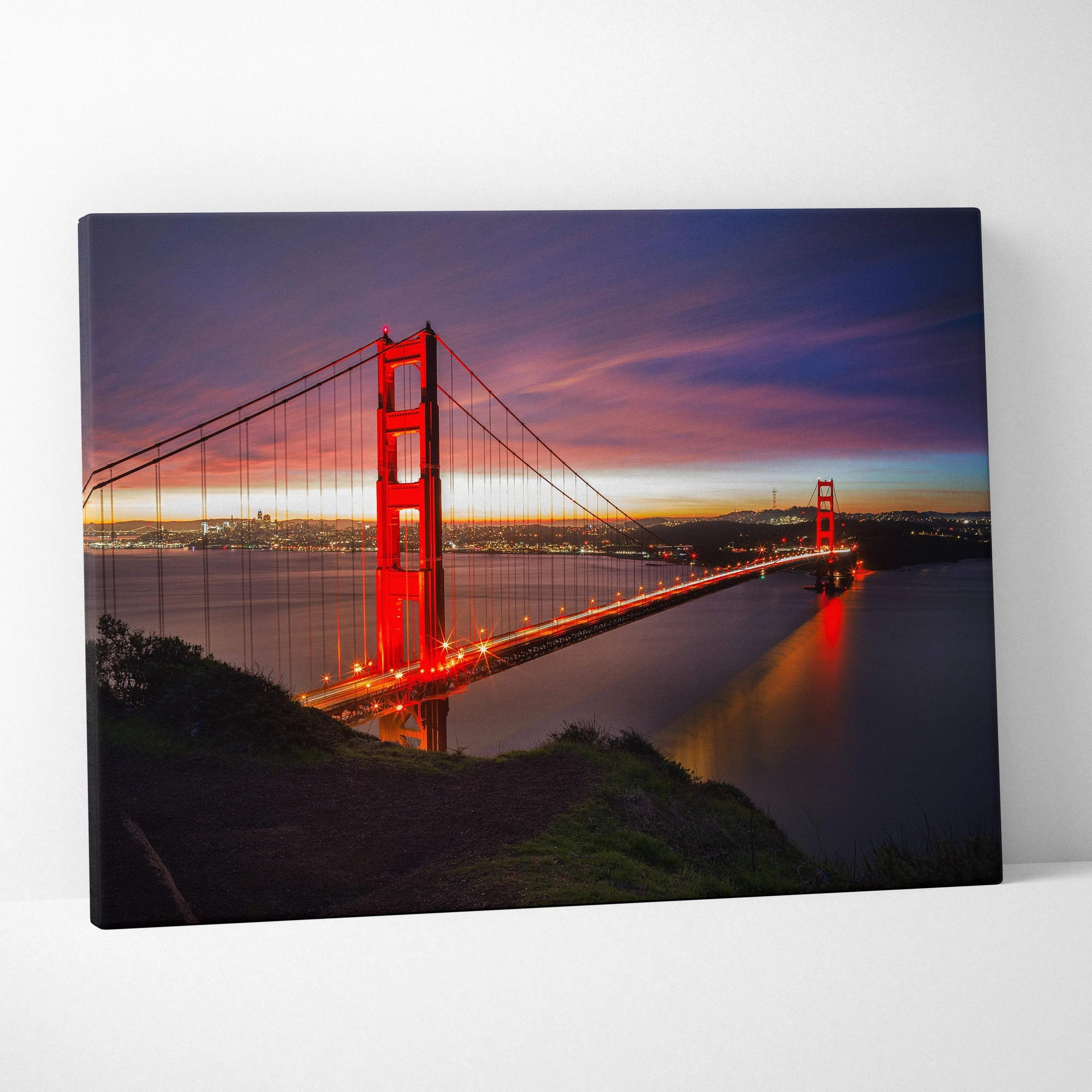 Golden Gate Bridge at sunset canvas wall art with vibrant sky and illuminated bridge lights.