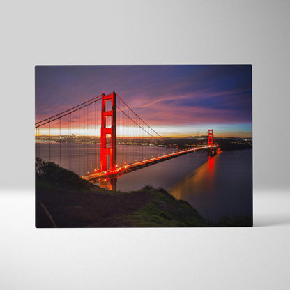 Golden Gate Bridge illuminated at dusk on canvas wall art with vibrant sunset sky.