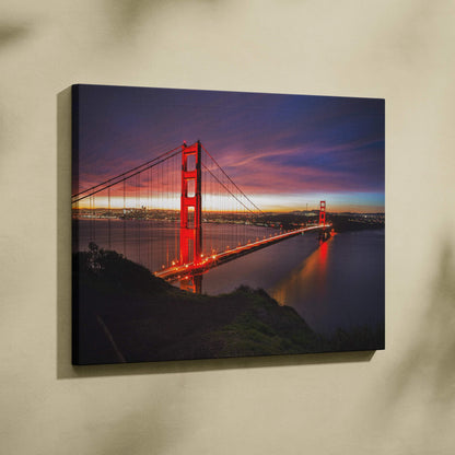 Golden Gate Bridge at sunset canvas wall art with vibrant red and purple sky colors.