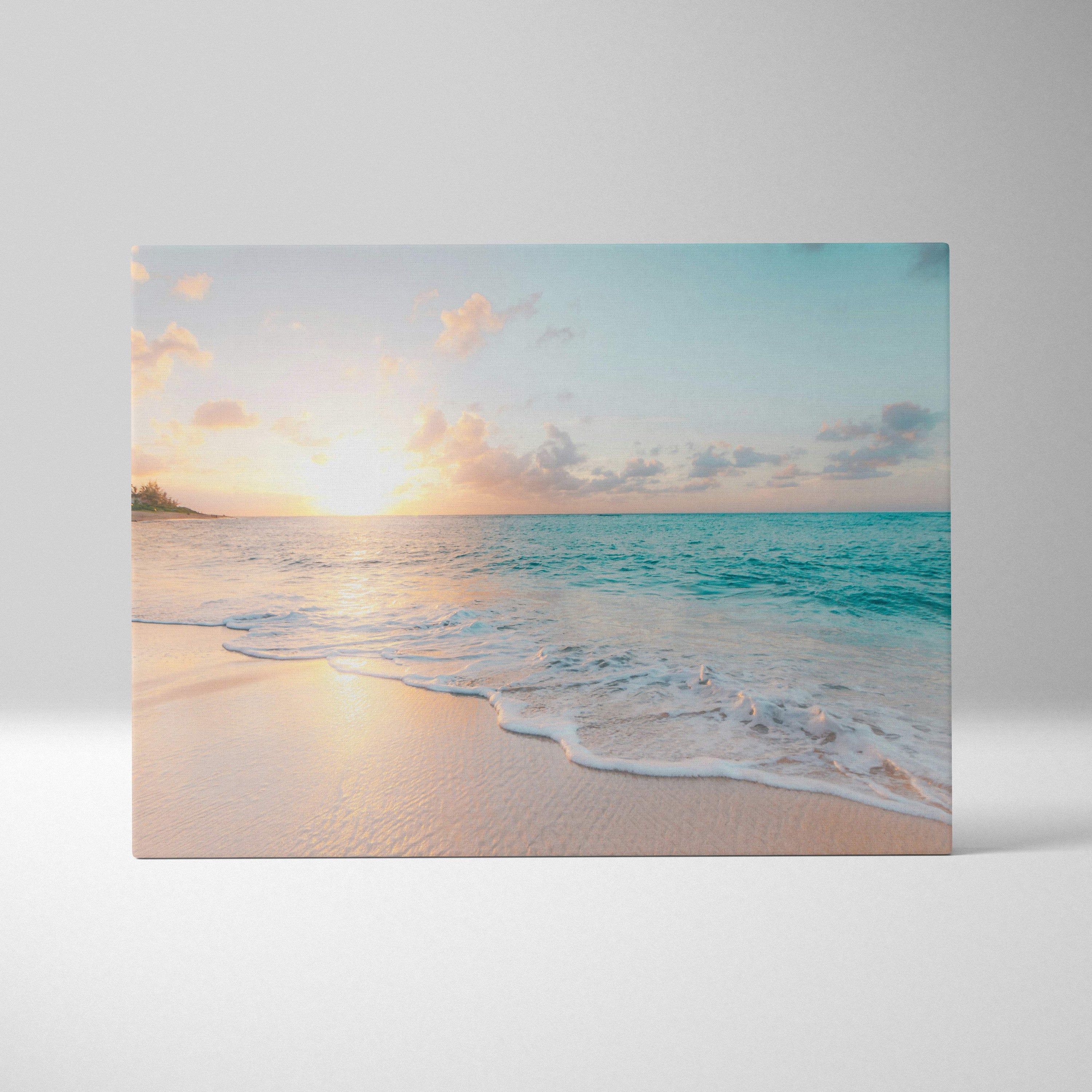 Tropical beach sunset canvas wall art print with soft pastel hues and gentle wave patterns for coastal decor
