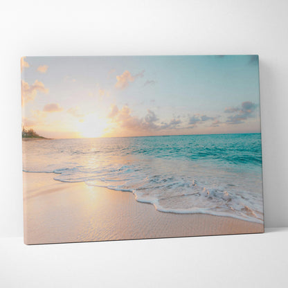 Beige canvas print featuring a tropical beach sunset with turquoise waves and soft pink sand for coastal decor