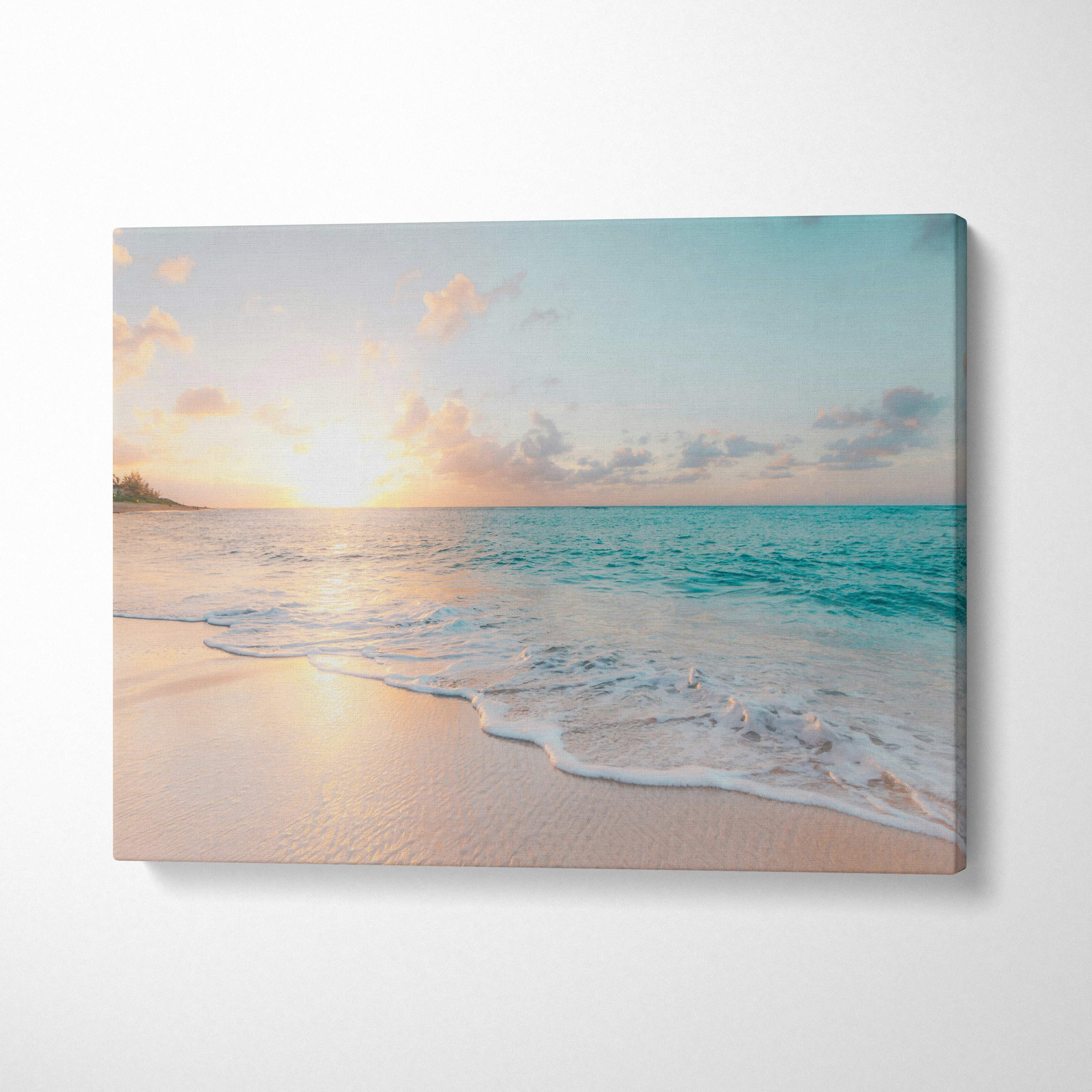 Tropical beach sunset canvas wall art print featuring a serene turquoise ocean with pink sand for coastal decor