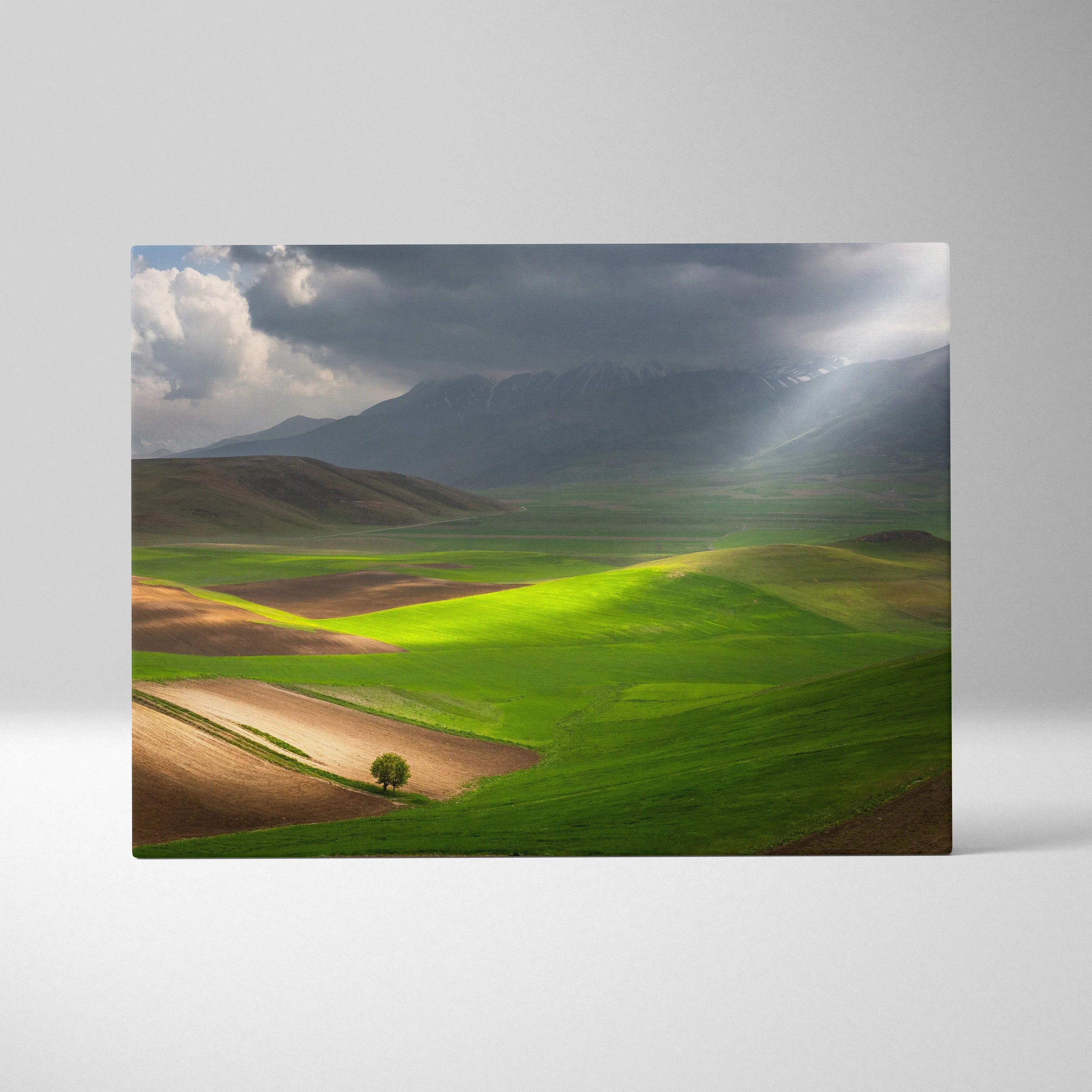 Cinematic sunlit valleys and rolling fields canvas art under stormy mountains