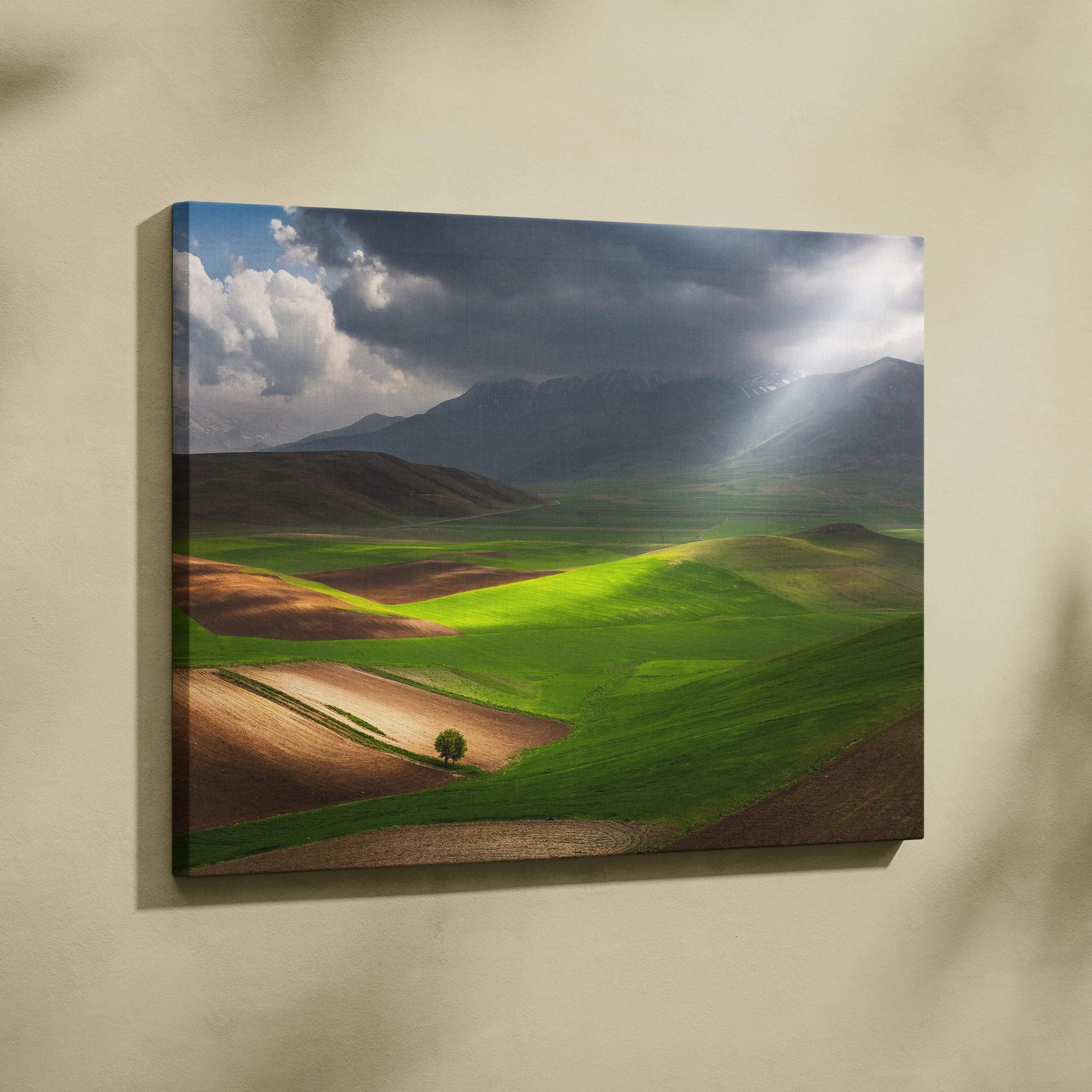 Cinematic sunlit valleys and rolling fields canvas art under stormy mountains