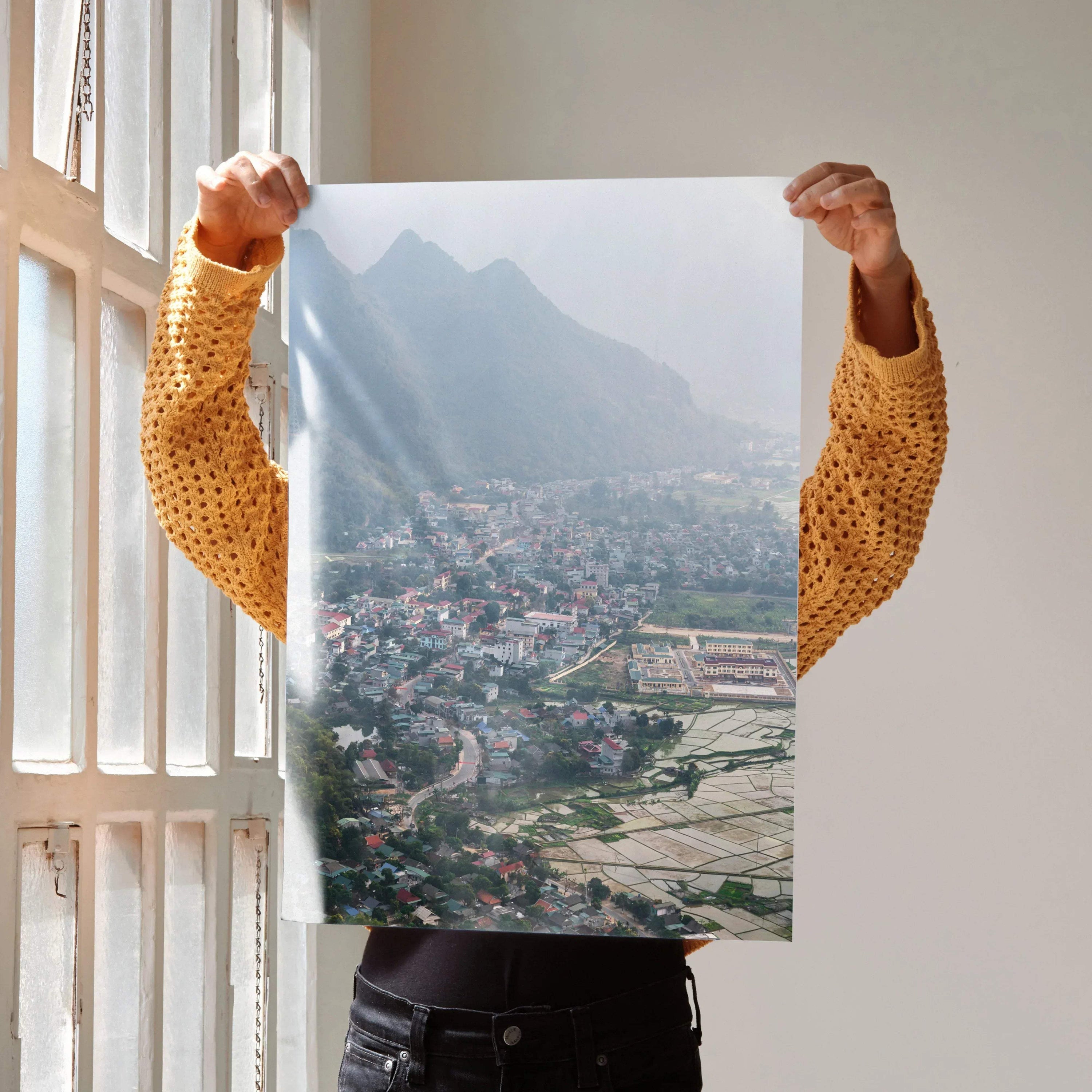 Urban cityscape art poster with colorful buildings and misty mountains, vibrant wall art.