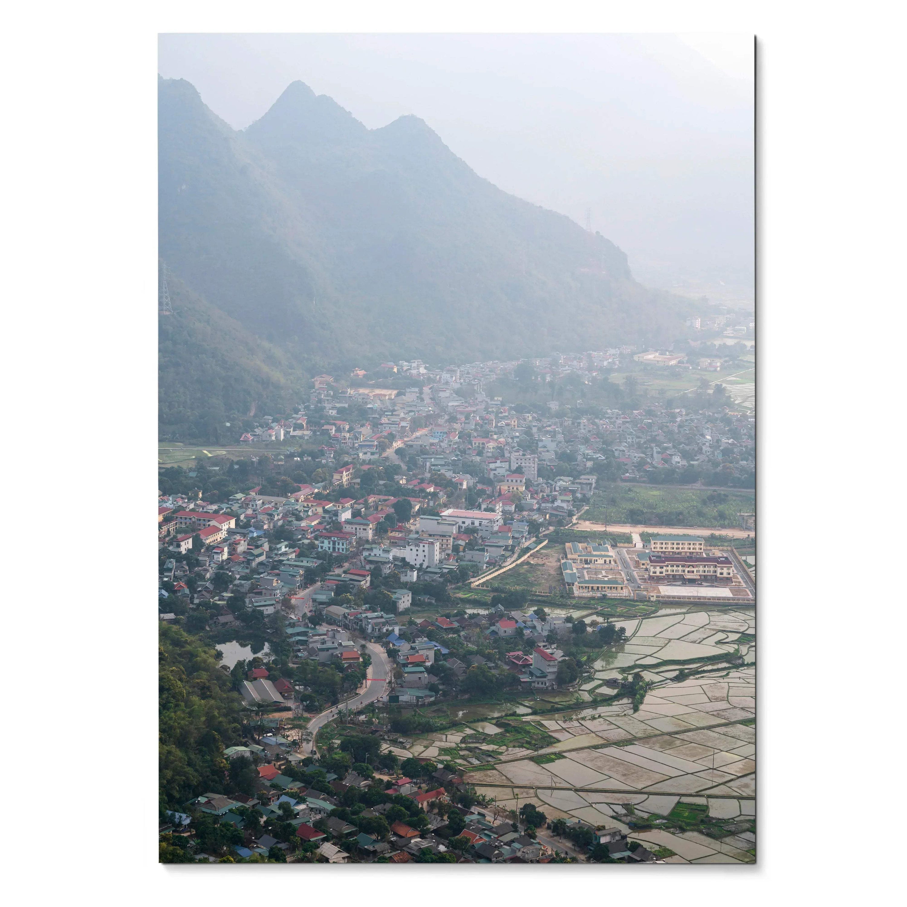 Vertical art poster of a misty urban cityscape with mountains and sprawling buildings wall art.