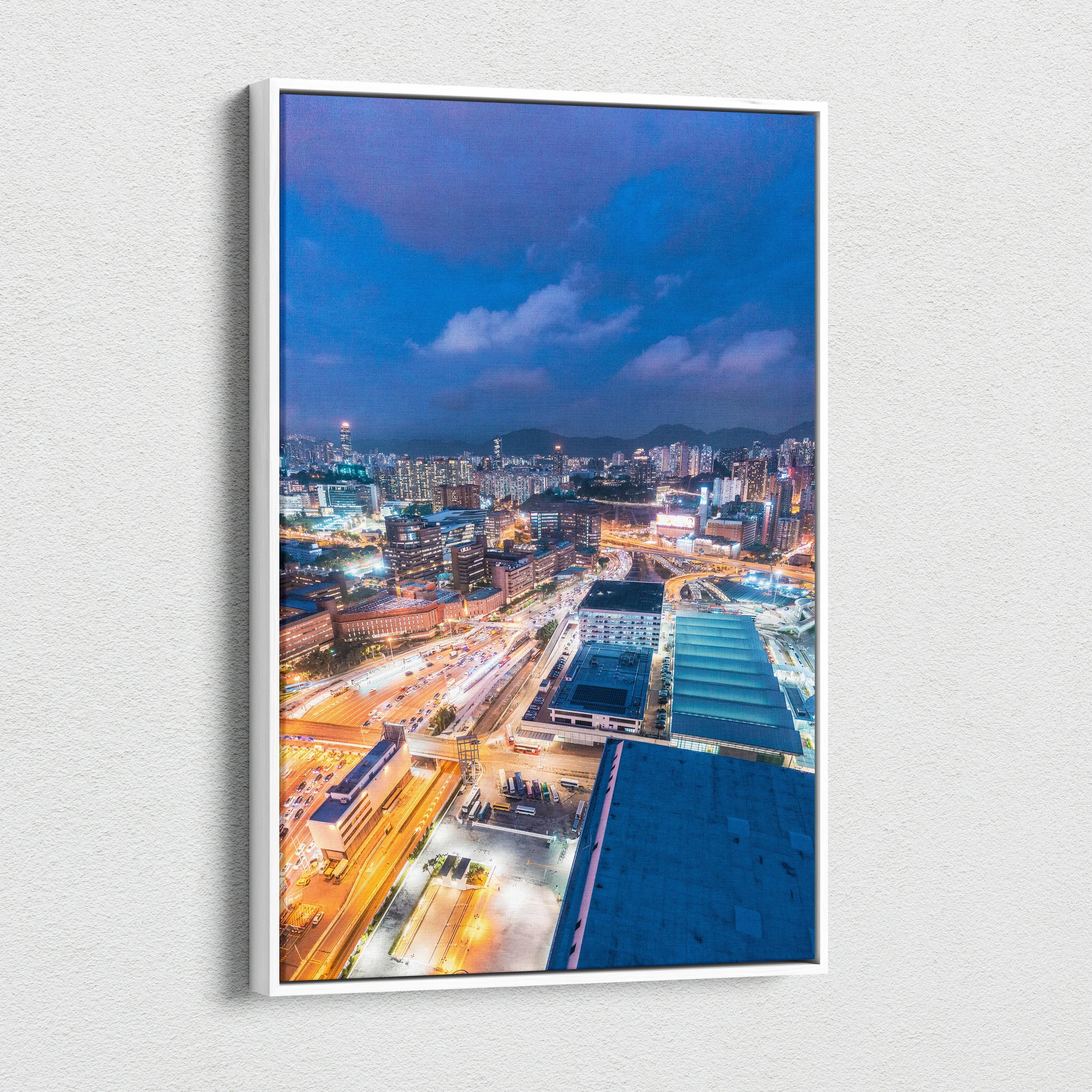 Vibrant modern cityscape canvas wall art with illuminated buildings and streets at dusk.