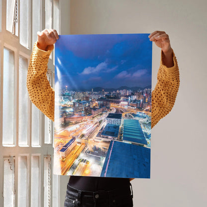 Stunning urban night skyline wall art poster with vibrant city lights and deep blue sky.