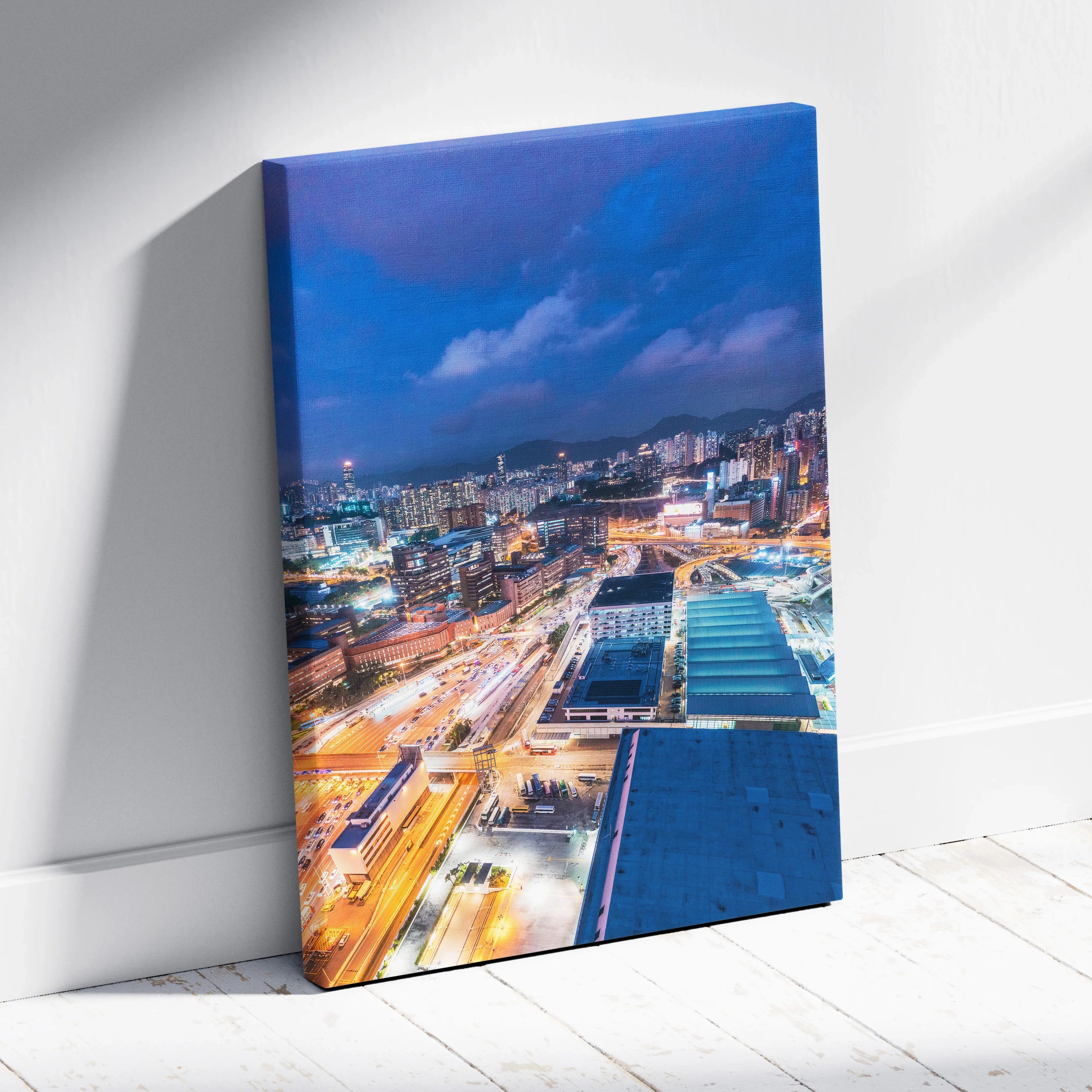 Vibrant modern cityscape at night canvas wall art with bright lights and buildings.