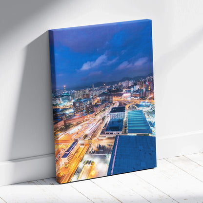Vibrant modern cityscape at night canvas wall art with bright lights and buildings.