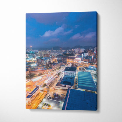 Vibrant modern cityscape canvas wall art with illuminated buildings and streets at dusk.