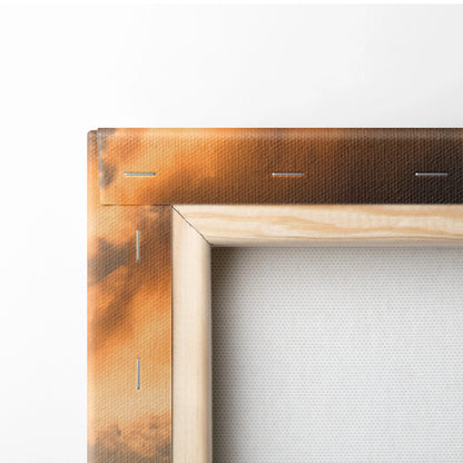 Close-up of stretched canvas corner with wooden frame and sunset-toned wall art texture.