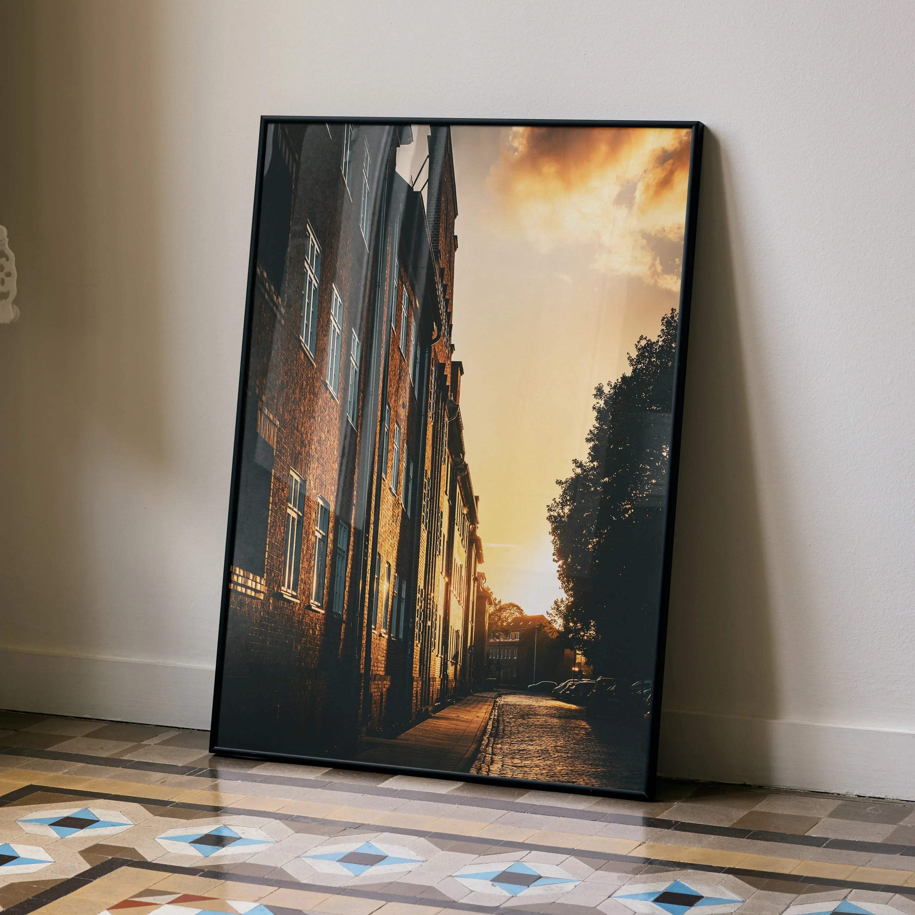 Vertical wall art poster of vibrant sunset cityscape with buildings and warm sky colors.
