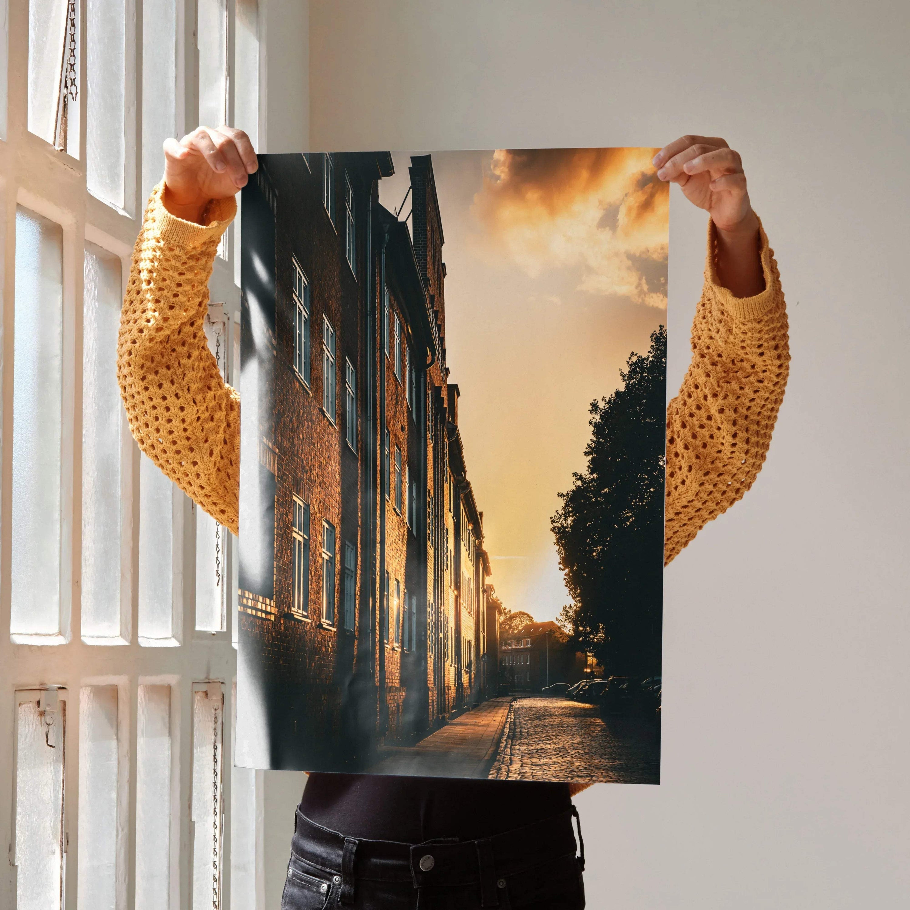 Vertical wall art poster featuring a vibrant sunset cityscape with illuminated buildings and a glowing sky.