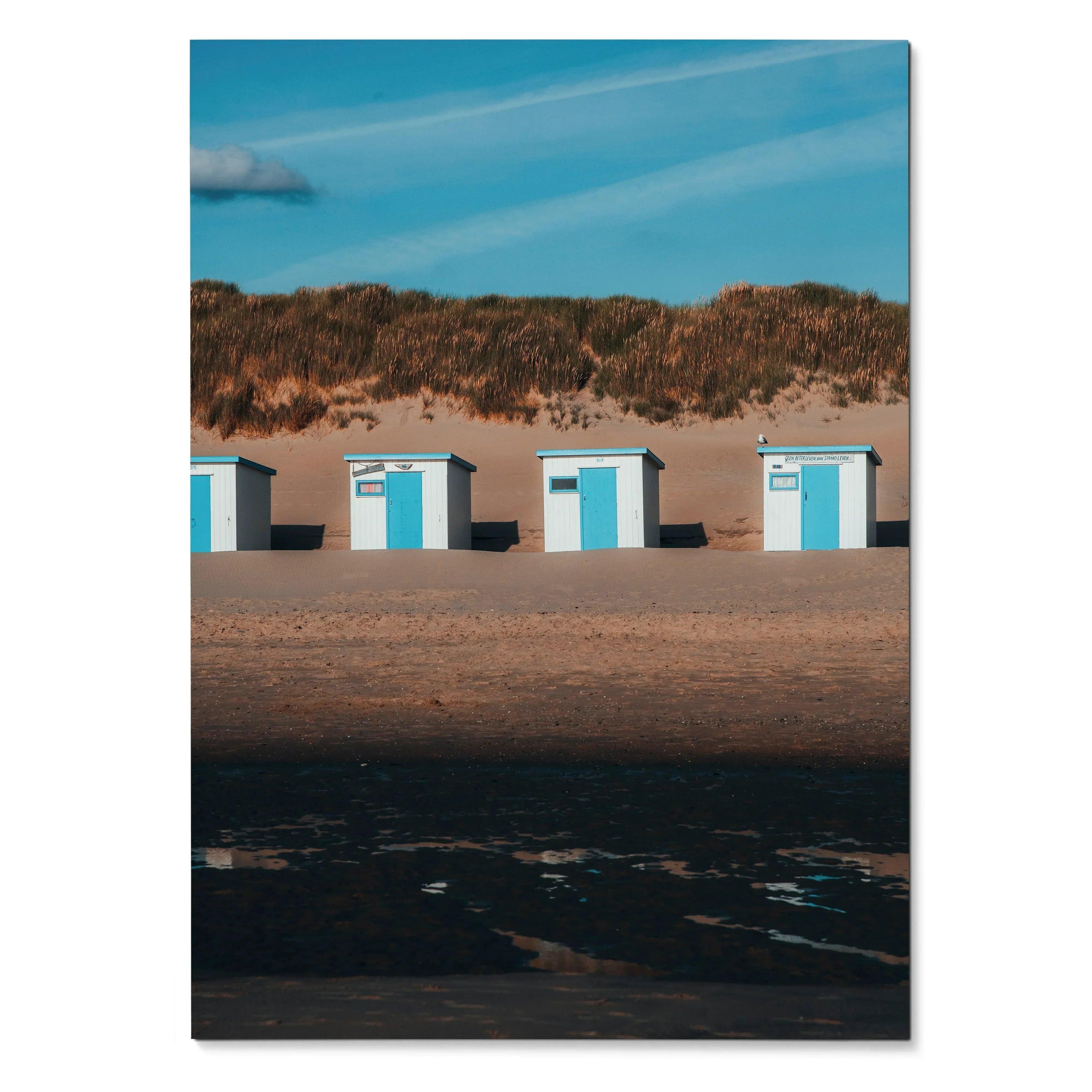 Serene beach landscape wall art poster showing four small blue and white beach huts under a blue sky.