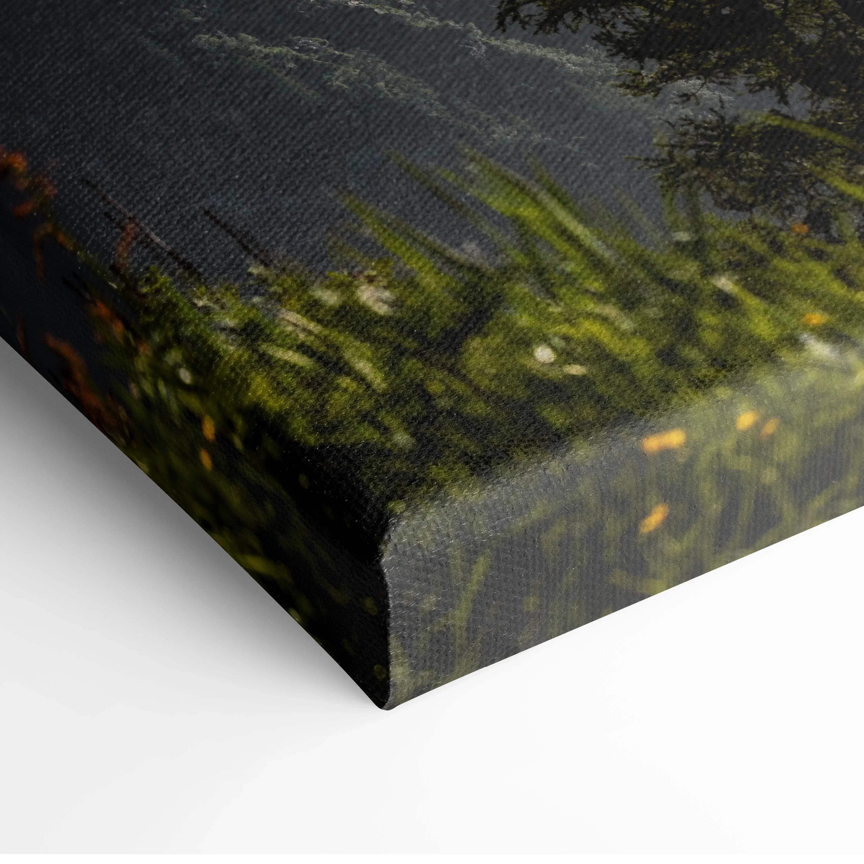 Close-up of textured canvas wall art corner showing detailed print of snowy mountains and green foliage.