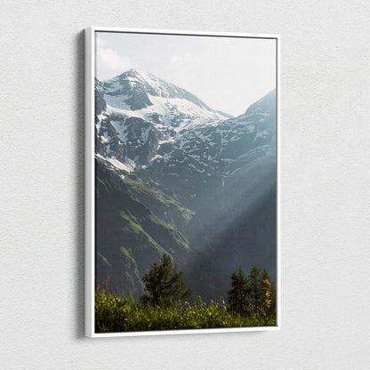 Snowy mountain peaks with sunlight rays on vertical canvas wall art.