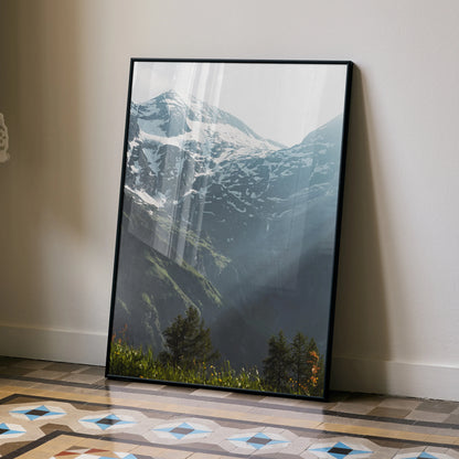 Vertical wall art poster of snow-capped mountains with sunlit valleys and lush greenery.
