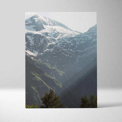 Vertical canvas wall art featuring breathtaking snowy mountain peaks with pine trees in the foreground.