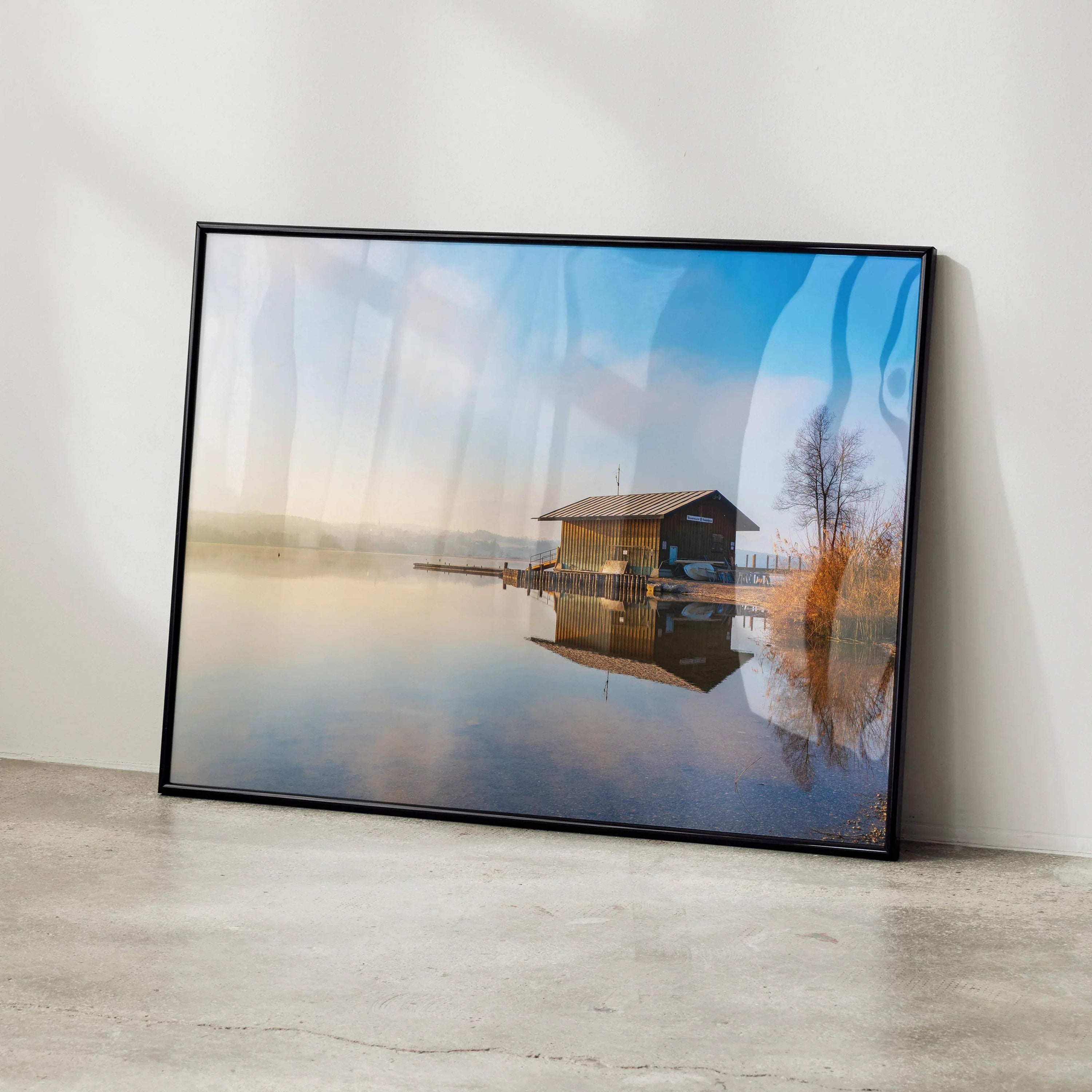 Majestic building landscape wall art poster with serene water reflection and soft blue sky.