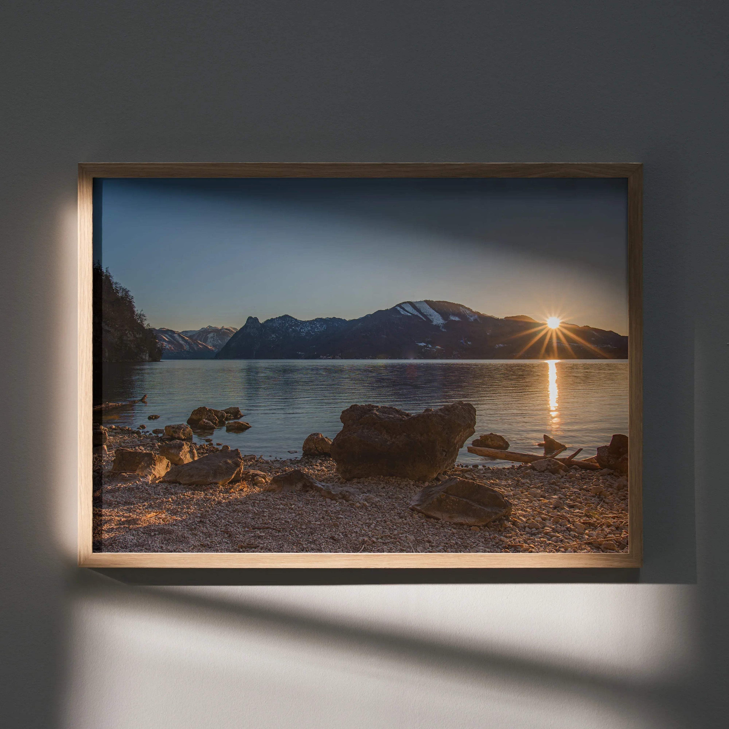 Majestic mountain sunset with sunburst over lake shore posters wall art in wooden frame.