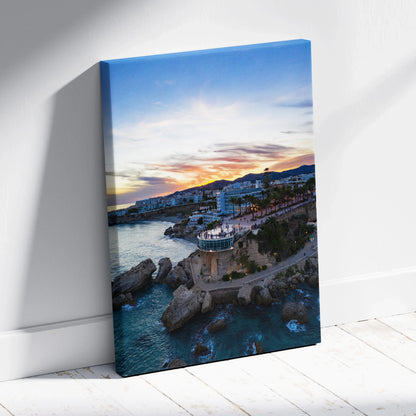 Vibrant city sunset skyline canvas wall art with colorful sky and illuminated buildings by the water.