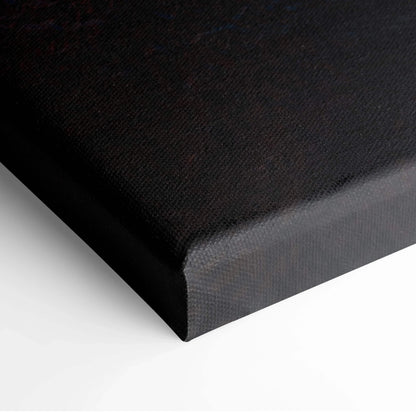 Black edge of stretched canvas wall art with textured fabric surface.