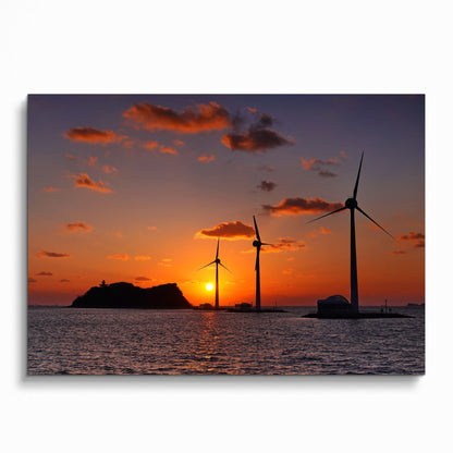 Ocean sunset with vibrant orange sky and wind turbines over water poster wall art.