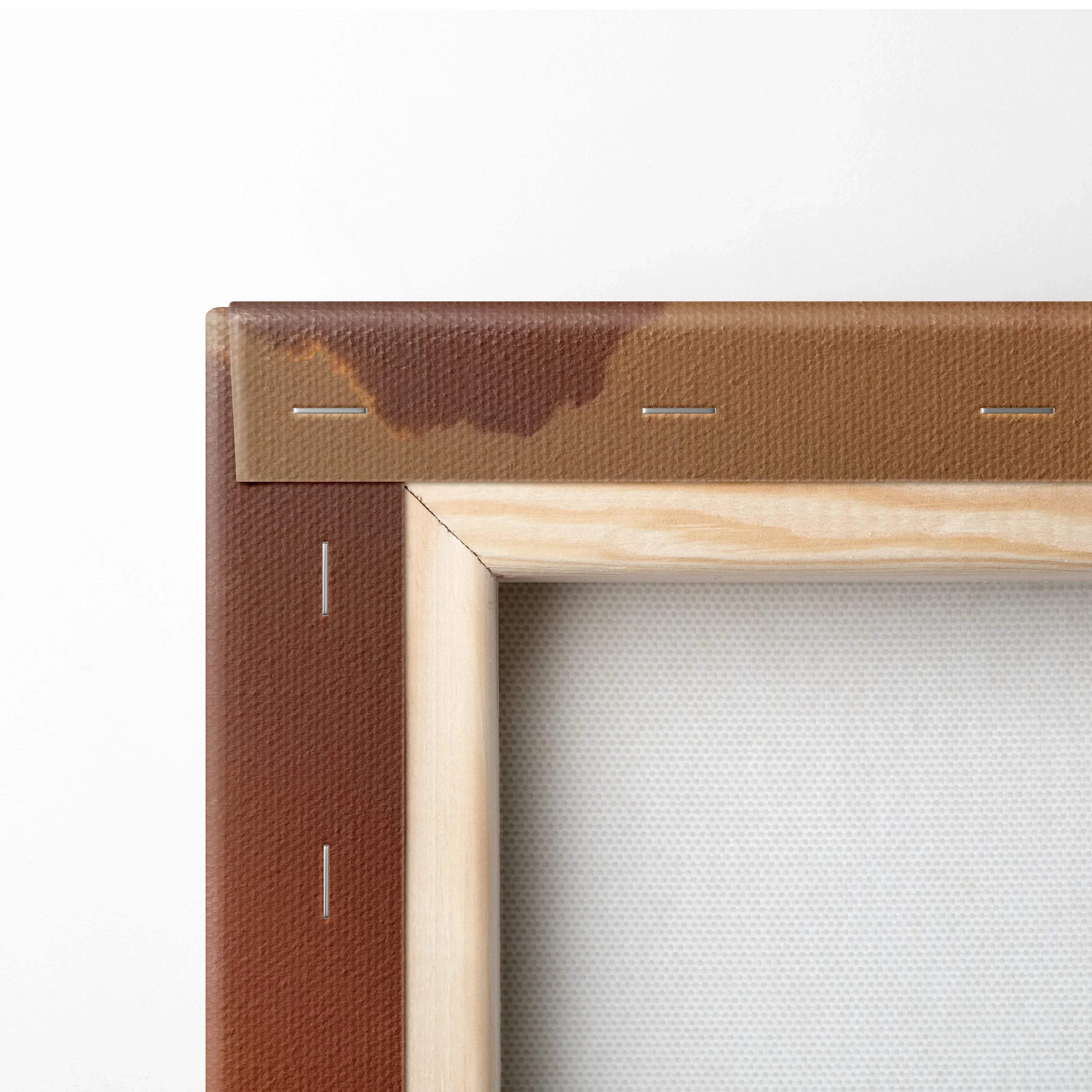 Close-up of wooden frame corner and stapled brown canvas fabric for wall art stretching.