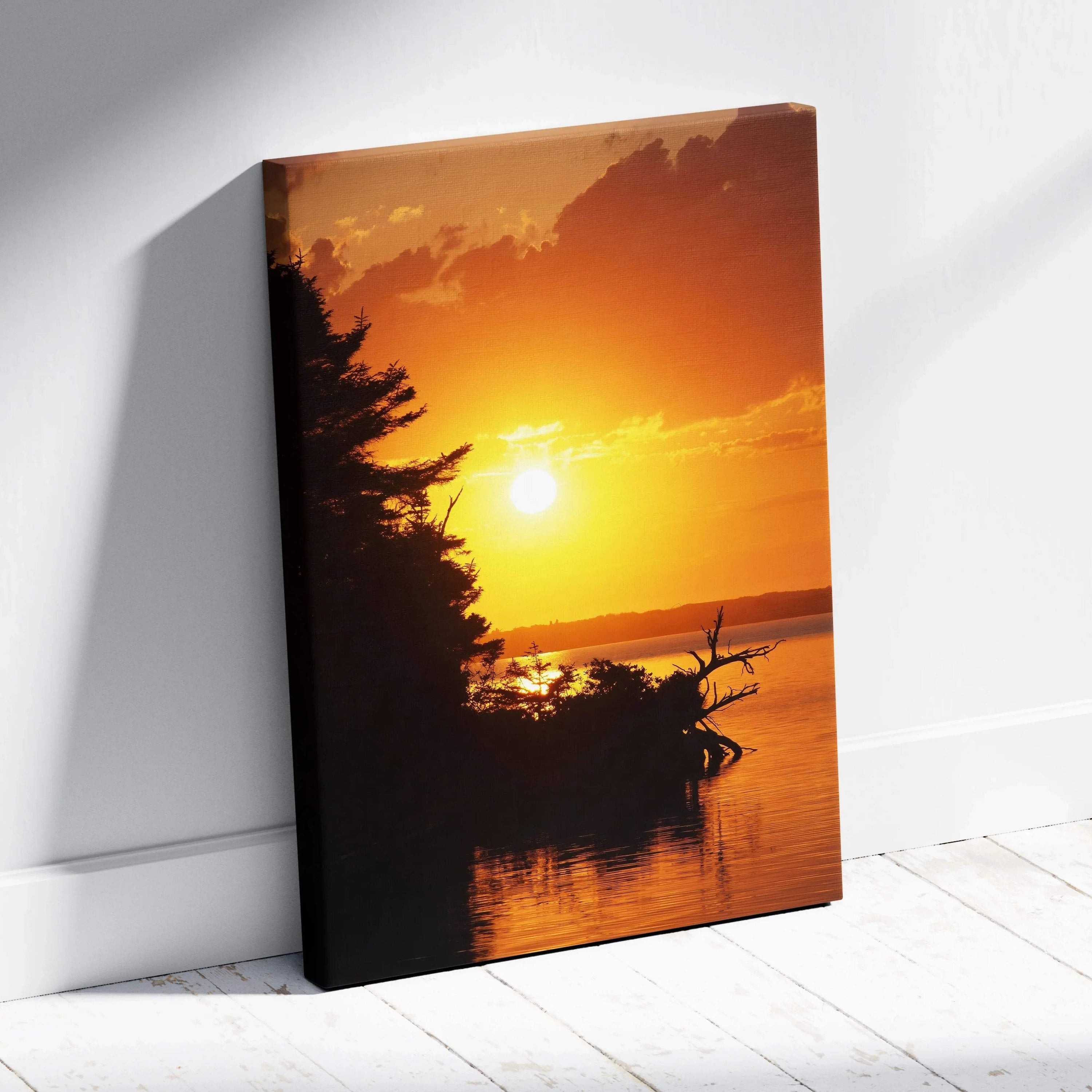 Canvas wall art featuring a vibrant beach sunset with silhouetted trees over calm water.