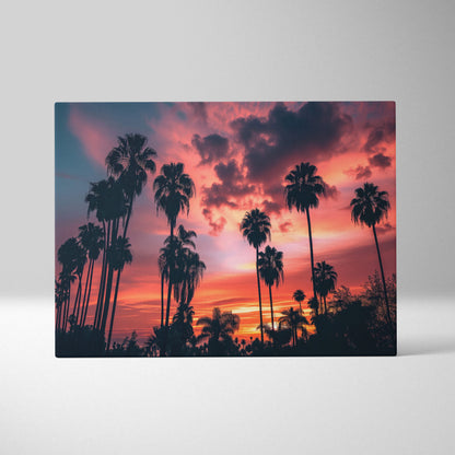 Canvas wall art featuring digital art of tropical palm tree silhouettes against a vibrant sunset sky with deep orange and.