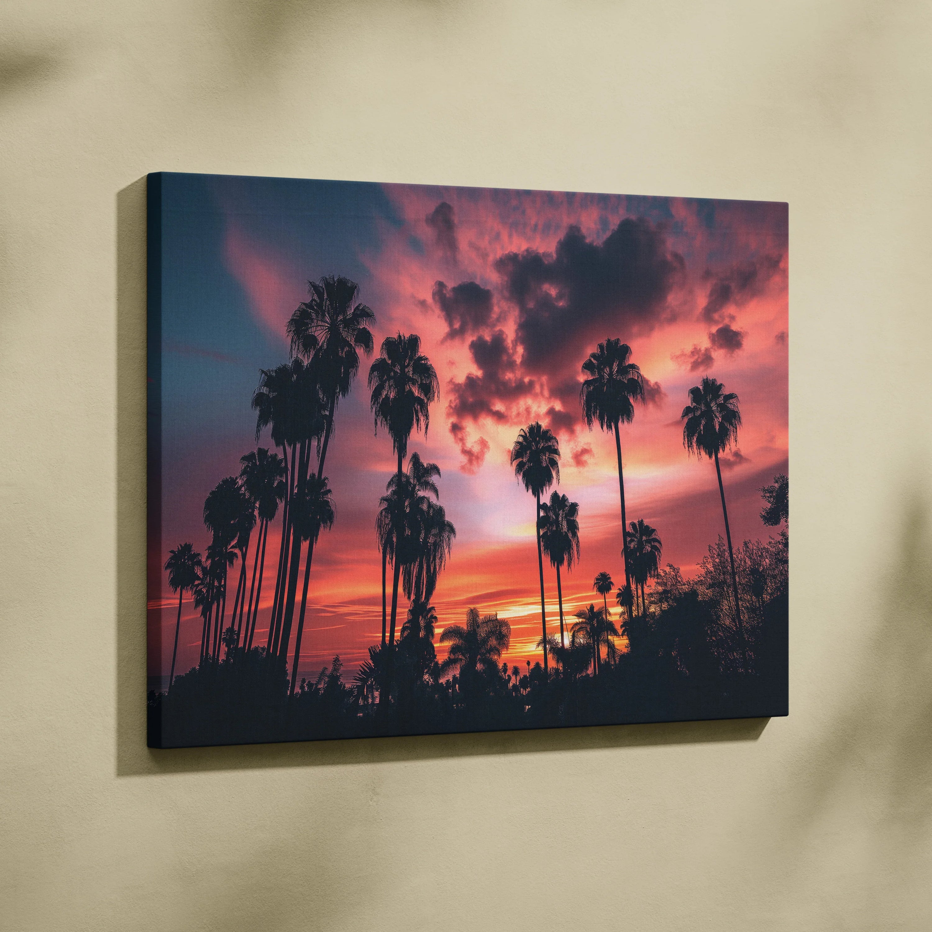 Canvas wall art featuring digital tropical palm tree silhouettes against a vivid pink and orange sunset sky.