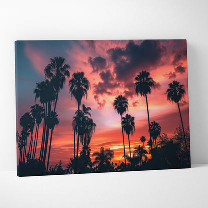 Canvas wall art featuring silhouettes of tall tropical palm trees against a vibrant red and orange sunset sky.