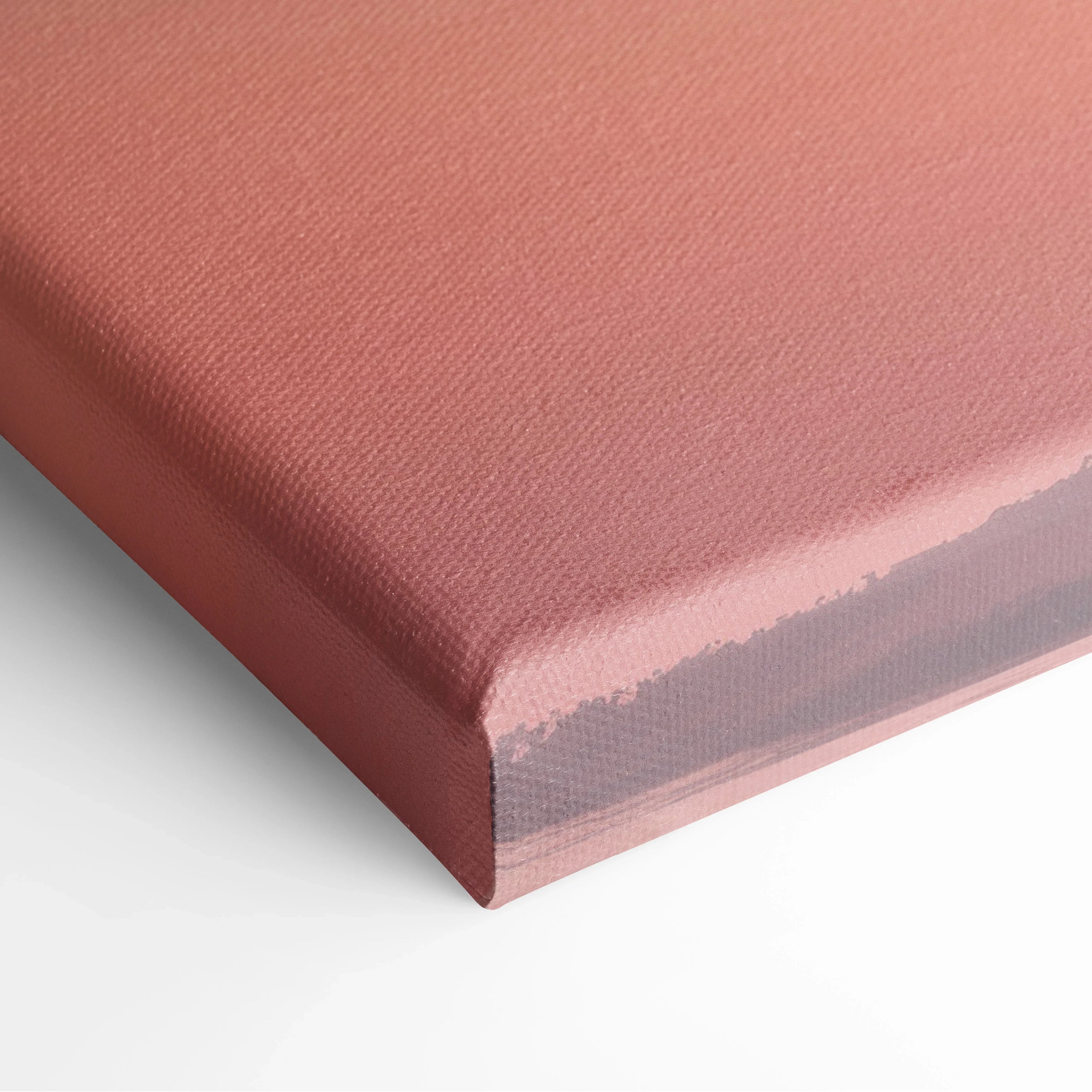 Close-up of textured canvas edge in warm sunset pink tones for tropical wall art decor.