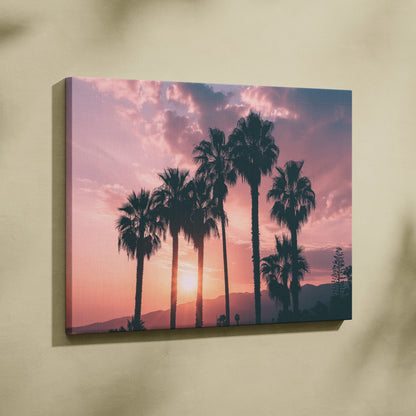 Canvas wall art of palm tree silhouettes against a warm pink and orange sunset sky decor.