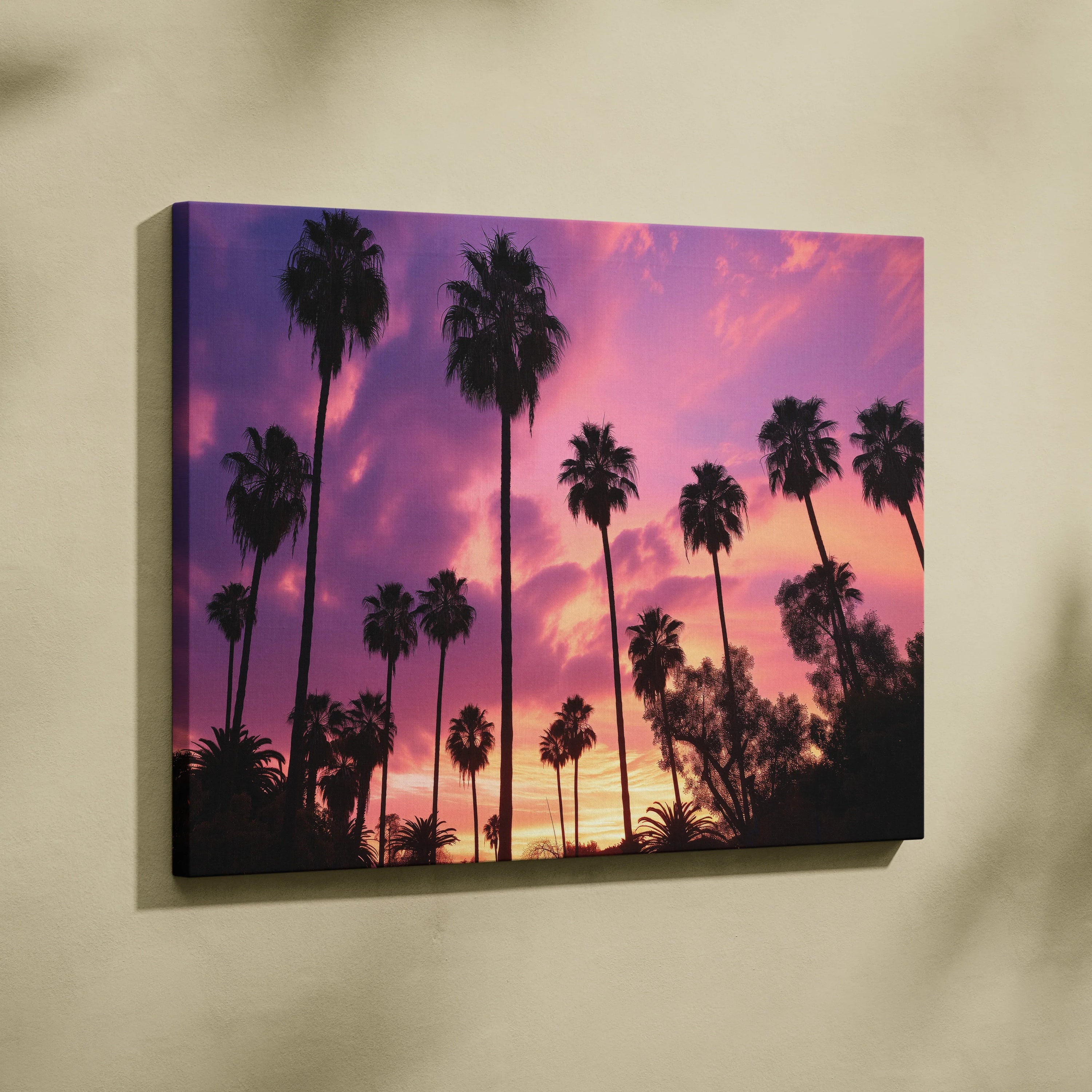 Canvas wall art featuring a tropical sunset with silhouetted palm trees against a vibrant purple and orange sky.