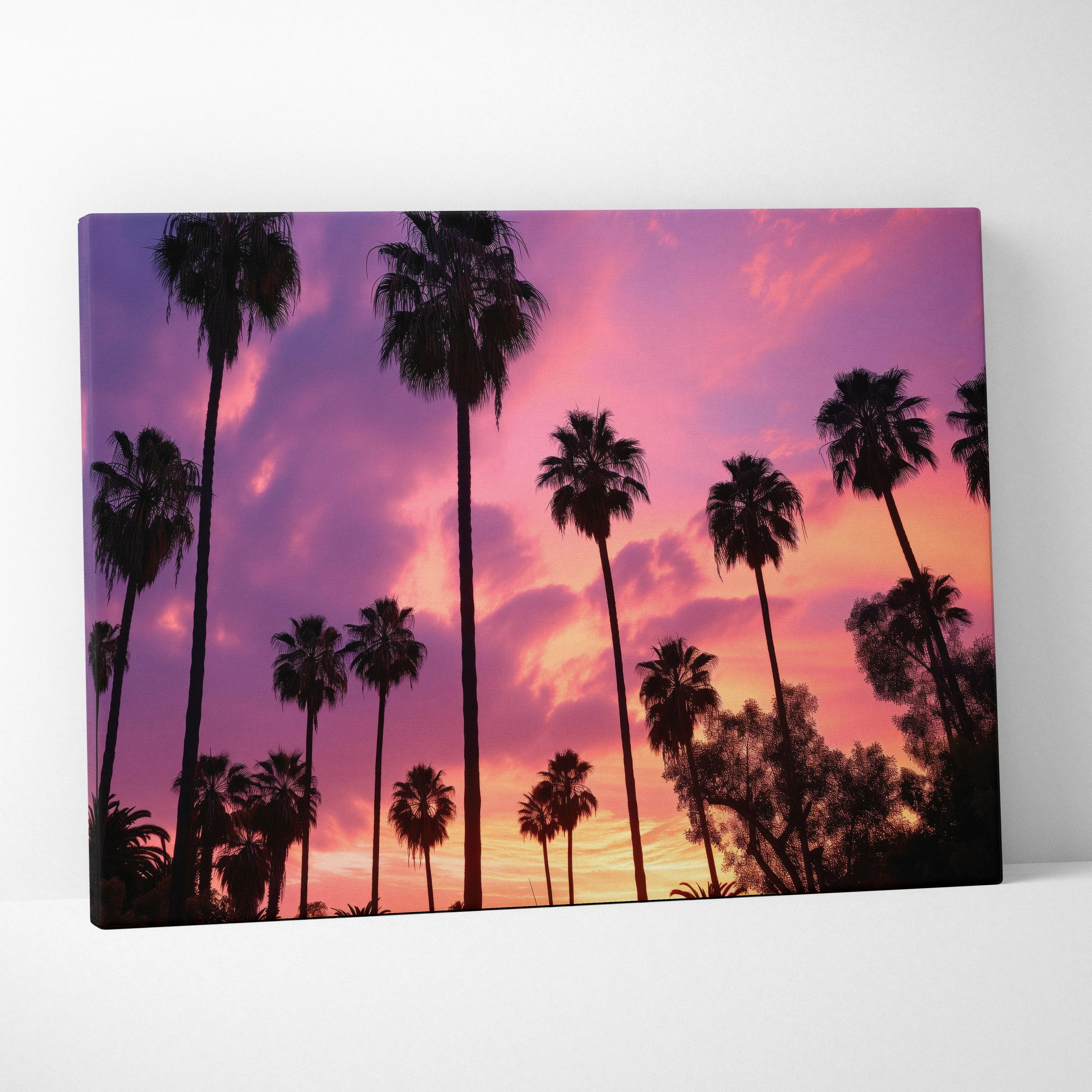 Canvas wall art featuring digital tropical sunset with silhouetted palm trees against a vibrant purple and orange sky.
