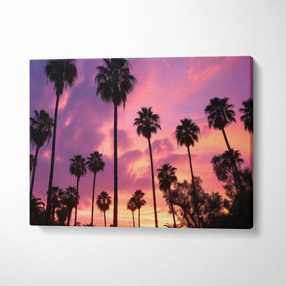 Canvas wall art featuring tropical sunset with dark palm tree silhouettes against a vivid purple and orange sky.