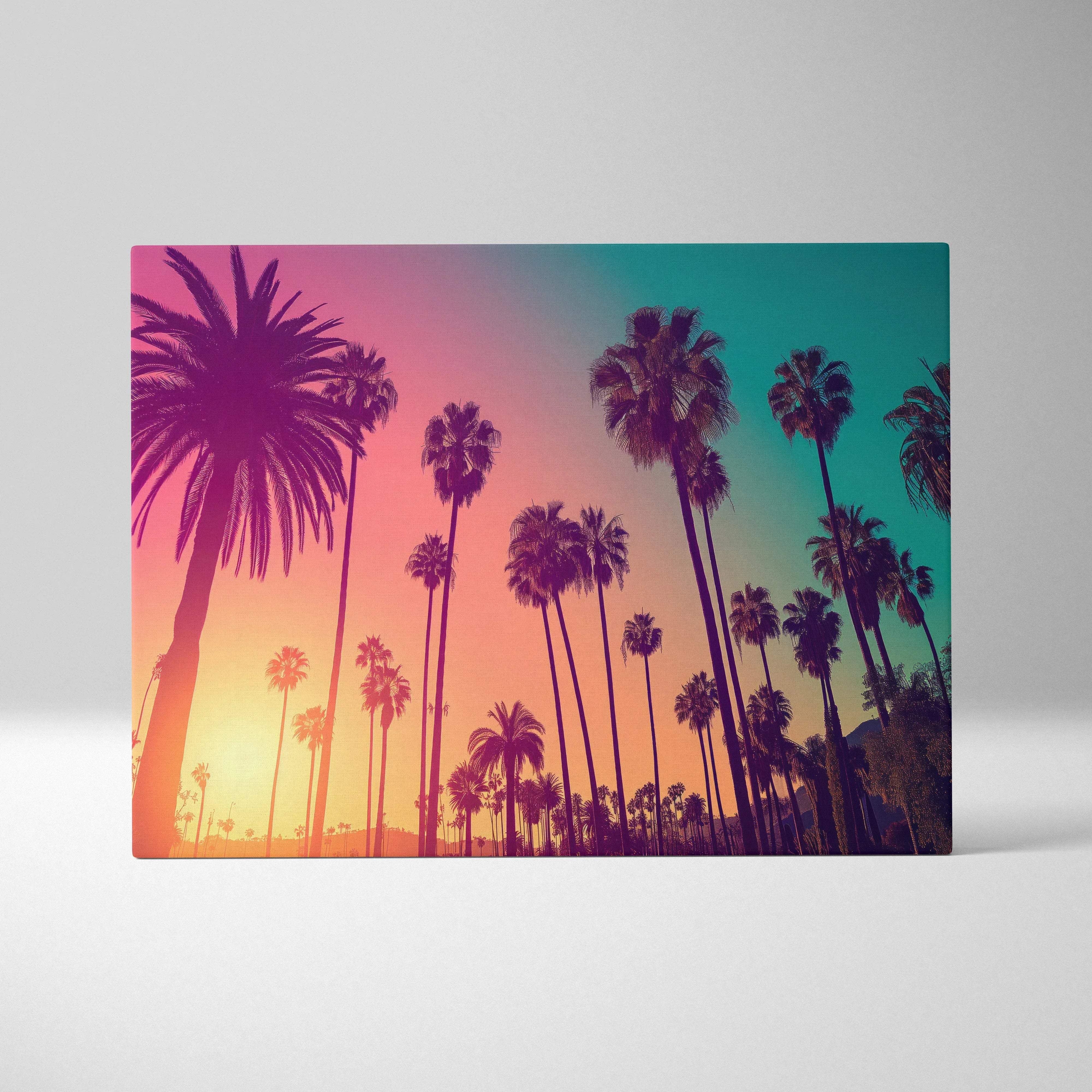 A rectangular canvas print of silhouetted palm trees against a vibrant coral peach teal sunset sky for wall art
