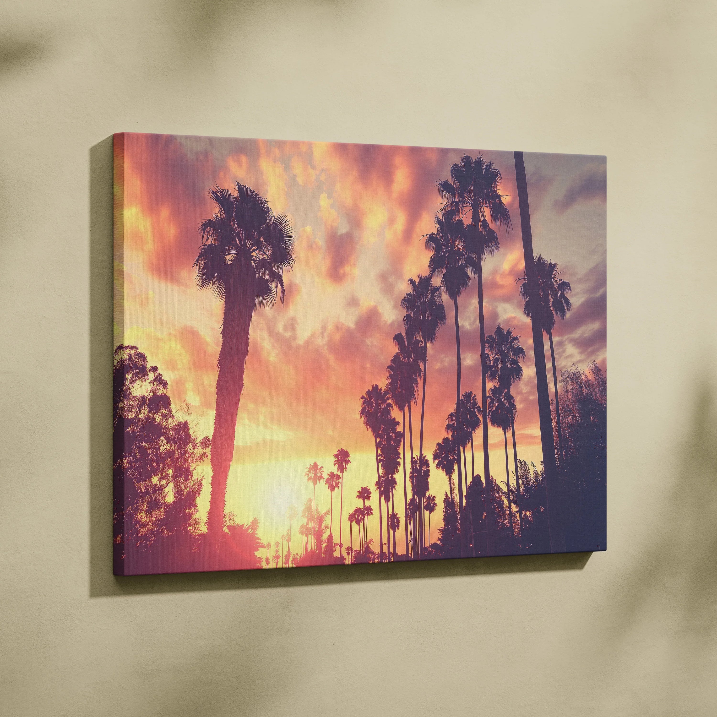 Tropical palm tree sunset silhouette canvas wall art with vibrant orange and purple sky decor.