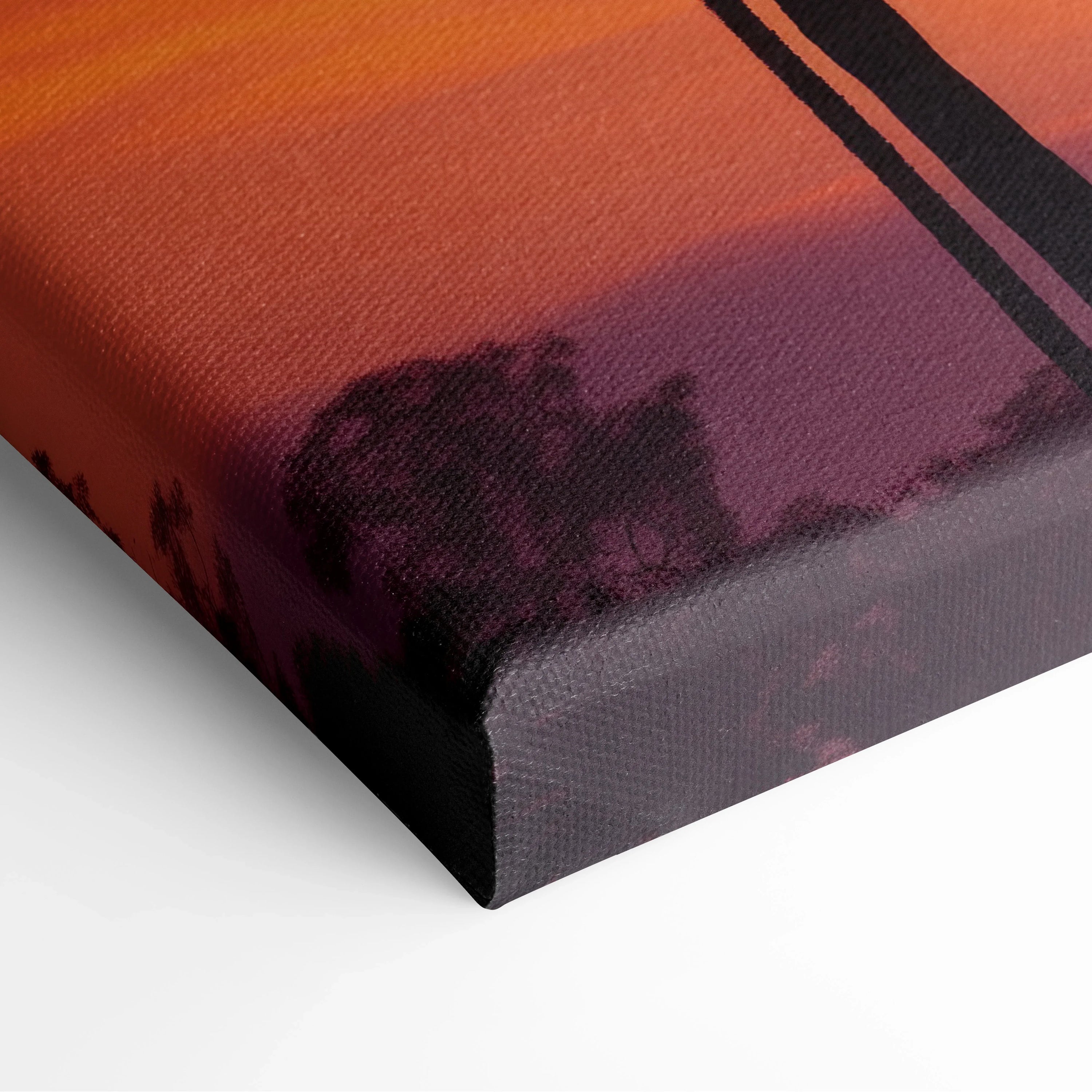 Canvas wall art featuring a tropical sunset with palm tree silhouettes in deep orange and purple tones.